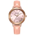 Close-up of pink leather watch band and rose gold dial with rhinestone markers - Pink