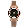 Detail of rose gold magnetic Milanese strap and faceted star-patterned dial on woman's watch - Watch Only / Rose Gold