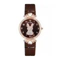 Detail of quartz watch featuring a glittery rabbit motif and heart-shaped gemstone accents - Brown