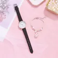 Close-up of women's quartz watch with black strap and floral charm bead bracelet - Black + Bracelet