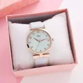Detail of rose gold quartz watch with white leather strap and a bow charm in a gift box - Light Blue With Box