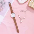 Detail view of women's quartz watch with brown leather strap and floral beaded bracelet - Brown + Bracelet