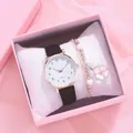 Close-up of minimalist women's quartz watch and beaded bracelet in a pink gift box - Black + Bracelet + Box