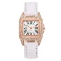 Detailed macro view of square rose gold watch case with crystal bezel and Roman numerals - Watch / White