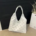 White seersucker tote bag with black floral print and Creative Cat label strap - White