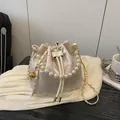 Chinese style embroidered bucket bag with pearl handle and floral jacquard pattern - White