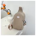 Japanese style khaki nylon chest bag with adjustable strap and minimalist logo detail - Khaki