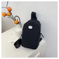 Japanese style black nylon chest bag with a cute white smile graphic patch - Black