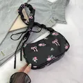Black nylon floral shoulder bag with pink roses and ribbon bow drawstring handle - Black