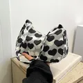 Chic underarm bag with black and white heart print and vintage canvas finish - Heart Style