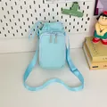 Hellblaue Mini-Umhängetasche aus Nylon mit Kordelzug und verstellbarem Schultergurt - Blau