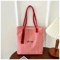 Detail of red and white striped canvas tote bag with Humin embroidery and side label - Red