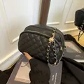 Elegant black quilted leather crossbody camera bag with dual zippers and gold chain strap - Black