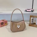 Khaki hobo handbag featuring a rhinestone heart buckle and crescent shape design - Khaki