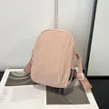 Waterproof apricot pink nylon crossbody bag with adjustable strap and brand embroidery - Pink