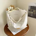 Cream white nylon crossbody bag with mini coin purse and gold lettering detail - White