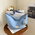 Sky blue nylon crossbody bag with matching mini round pouch and dark blue strap - Blue