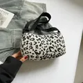 Corduroy leopard print shoulder bag with adjustable black strap in white and black - White