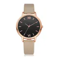 Detail of rose gold minimalist watch with Roman numerals and beige leather strap - Khaki Watch Only