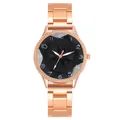 Detail of rose gold metal watch band and black dial with floral relief pattern - Watch Only / Black