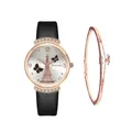 Detail of rose gold watch with Eiffel Tower dial and matching star pendant bracelet - Black + Bracelet