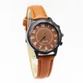 Retro quartz watch with brown leather strap and faceted glass over a wavy black dial - Chocolate