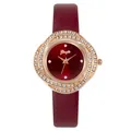 Macro detail of wine red sunburst dial and rhinestone bezel on fashion leather watch - Watch Only / Red