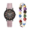 Detail view of pink leather watch with rose gold dial and colorful beaded bracelet - Wristwatch And Colored Beaded Bracelet / Pink