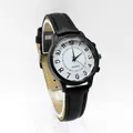 Detail view of quartz watch featuring black leather strap and textured numeric dial - Black Strap White Dial