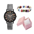 Detailed close-up of ladies' black dial quartz watch with grey leather strap and beaded bracelet - Wristwatch And Beaded Bracelet And Gift Packaging / Gray