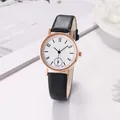 Detail of rose gold watch face featuring delicate snowflake patterns and black leather strap - Black