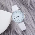 Minimalist women's quartz watch with slim white leather strap and silver round dial - White