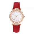 Detailed close-up of a floral red leather watch with crystal-encrusted bezel and dial - Red