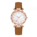 Detail of rose gold starfish watch face with floral patterns and a brown leather strap - Brown