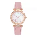 Detailed shot of women's rose gold quartz watch with rhinestone bezel and pink leather strap - Pink