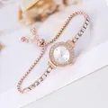 Detail of rose gold ladies watch with rhinestone bezel and adjustable slider chain - Bracelet Watch / White