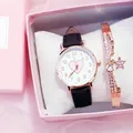 Close-up of heart-patterned watch and star bracelet set in a pink gift box - Black Watch And Bracelet With Box