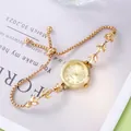 Detail of gold-tone bracelet watch with crystal leaf links and adjustable bolo sliding clasp - Gold