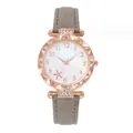 Detail of rose gold case with crystal bezel and floral pattern dial on gray leather strap - Gray