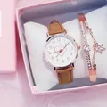 Close-up of heart pattern ladies watch with rose gold case and starry charm bracelet - Brown Watch And Bracelet With Box