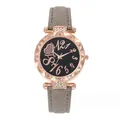Detail of rose gold lace bezel watch with black starry dial and grey suede strap - Watch Only / Gray