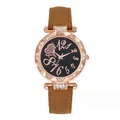 Close-up of black starry dial with rose gold artistic numerals and rhinestone bezel - Watch Only / Brown