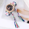 Detail of rose gold watch with starry butterfly dial and colorful woven fringe strap - Pink Blue Green Multicolor