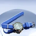 Luminous quartz watch with gold case and blue white striped nylon NATO strap on mirror - Light Blue