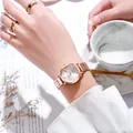 Detail of rose gold quartz watch on wrist with marble background and morning coffee scenery - White