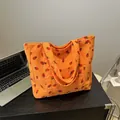 Oranje corduroy draagtas met aardbeienprint en grote capaciteit schouderbanden - Oranje