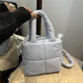 Quilted light blue square puffer handbag with padded handles and long shoulder strap - Blue