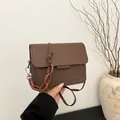 Deep brown crossbody bag with marble resin chain strap and matte finish for women - Brown