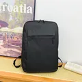 Minimalist black waterproof business backpack for travel with a front zipper pocket - Black