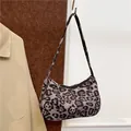 Stijlvolle schoudertas met panterprint en ritssluiting voor trendy damesmode - Zwarte Luipaardstijl